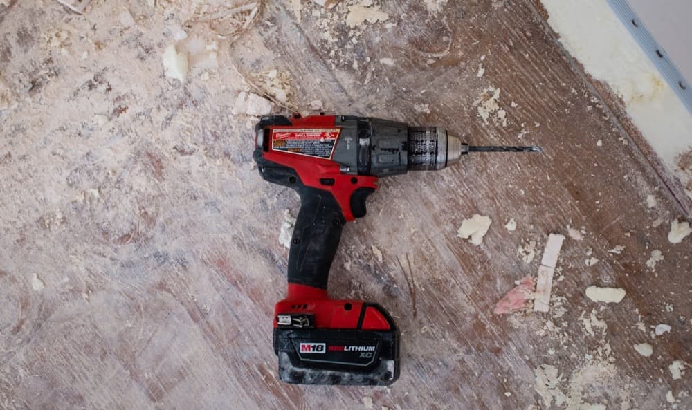 Cordless drill resting on a workbench
